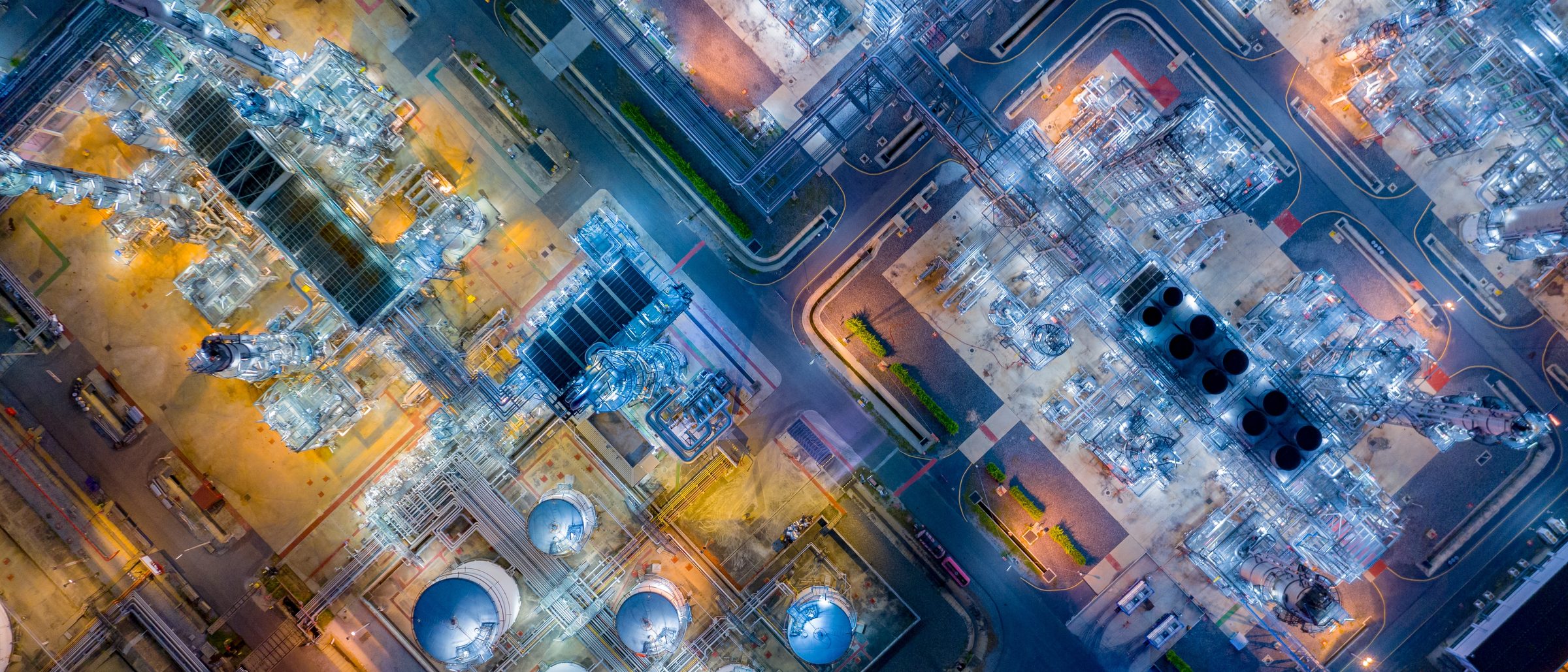 Aerial night view of a petroleum refinery and tank storage terminal